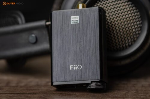 Fiio E10K resting against the Philips Fidelio X2HR